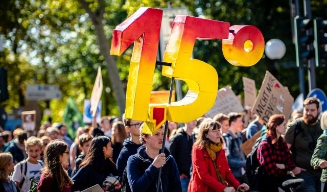 A climate march with 1.5C banner
