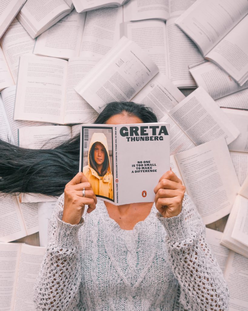 Woman reading Greta Thunberg's book